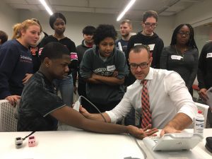 Prof Kevin Heffernan works with exercise science and high school students on a exercise physiology project