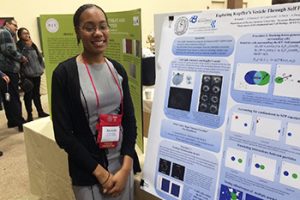 Kassidy Lundy with her poster, Exploring Kupffer's Vesicle Through Self Propelled Particle Simulations
