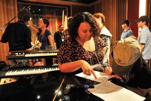 Music education students work with students who have intellectual disabilities to record music during the two-week Inclusive Music Recording Studio.