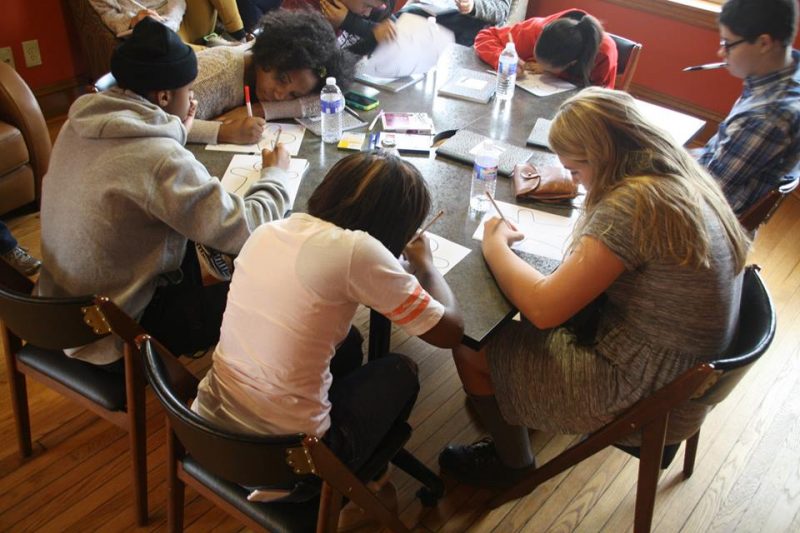 Young writers work on a project during the Writing Our Lives conference in 2014.