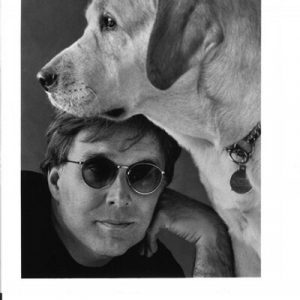 Steve Kuusisto poses with his guide dog Corky