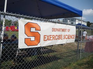 Exercise science banner hung on the women's building fence