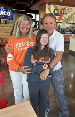 amy, kate, and david allyn smile for the camera