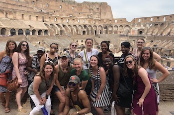 A group of students in an old Roman amphitheater