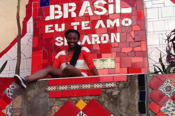 Ashley Smith-Purviance next to a sign in Brazil