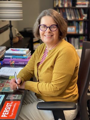 Beth Ferri at desk