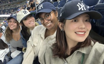 Four students at a baseball game
