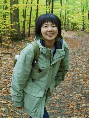 Coco Wing Yun Wong stands in a woodland