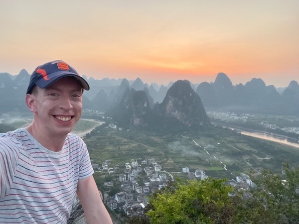 Evan Wichman ’12 with a view from the top of Lao Zhaishan