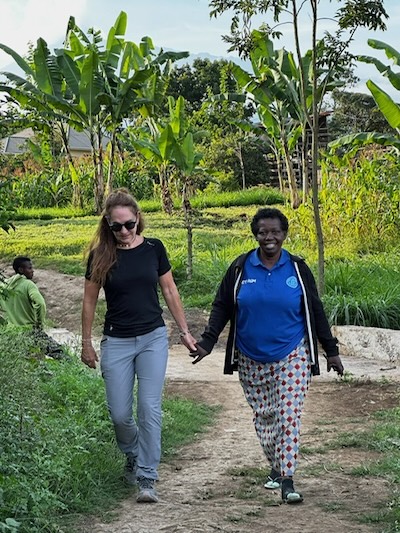 Two women walk hand in hand