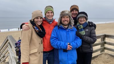 A family of different generations stands as a group