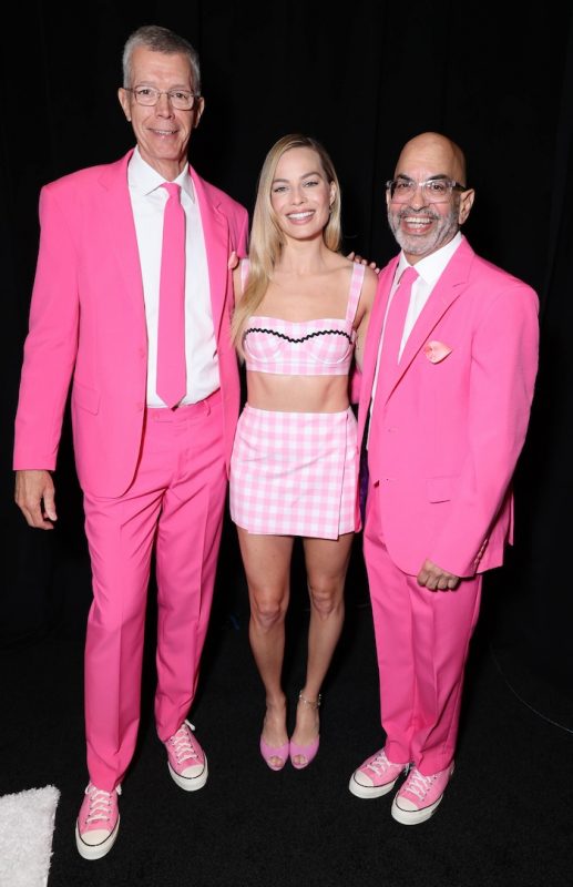 Three people posing for a photograph. 