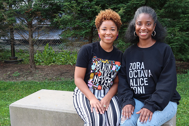 courtney mauldin and marcelle haddix sitting outside of huntington hall