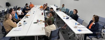 A group of faculty and staff around a long table