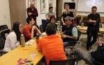 A group of students discussing an Intelligence++ project
