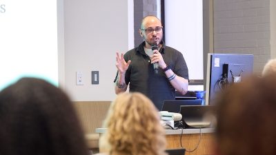 Jersey Cosantino speaks at a conference