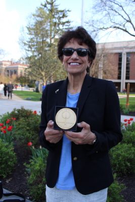 Linda LeMura holds her Tolley Medal