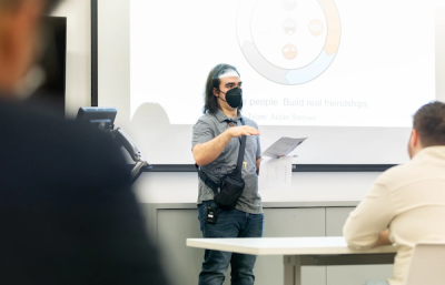An InclusiveU student gives a presentation