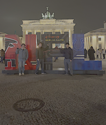 Students stand at the Brandenburg gate in Berlin