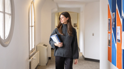 A social, work student in a corridor
