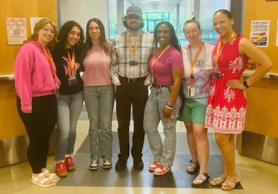 A mixed group of student teachers take a group photo