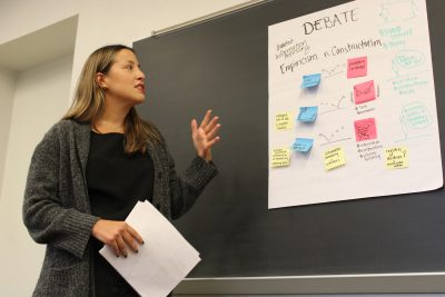 a graduate student presents to a class