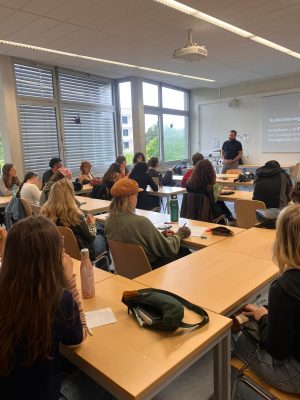Students and faculty in a seminar room
