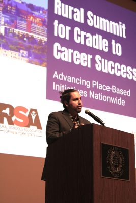 A professor speaks at a podium