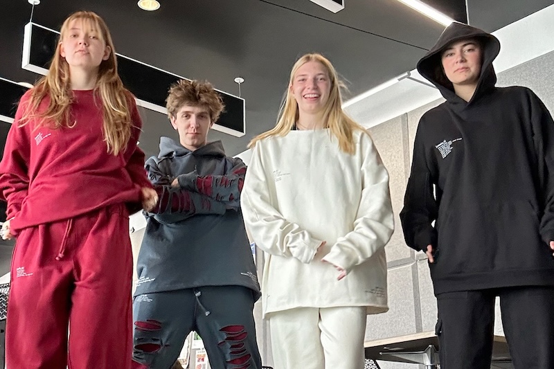 Four students model clothing