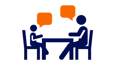 School counselor icon: two people speaking across a table