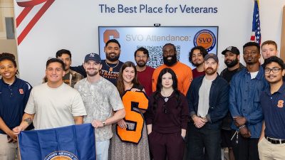 A diverse group of military veterans pose together