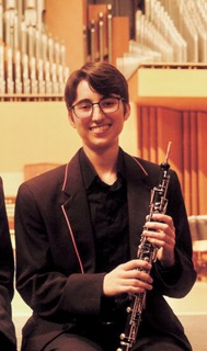 Sydney Kincaid holding a musical instrument 