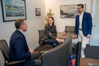 THree professors chat together