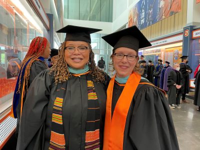 eva williams and amie redmond in caps and gowns at school of education convocation