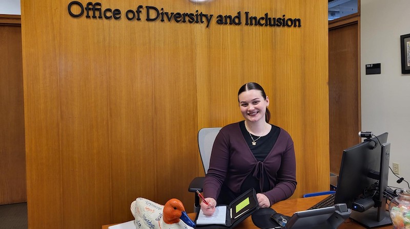Carlee Kerr in front of the Office of Diversity and Inclusion