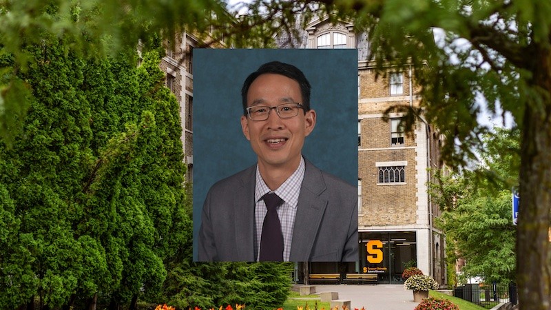 Headshot of Huey Hsiao in front of school of ed