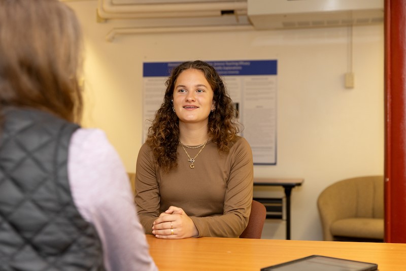 A students in a practice simulation with an actor