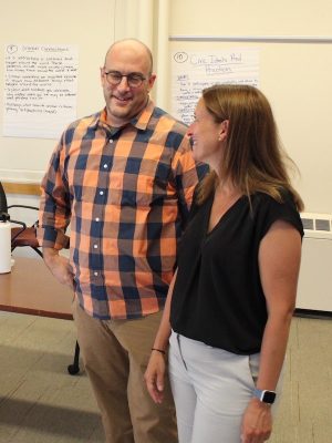 Professors Theoharis and Myers standing beside each other.